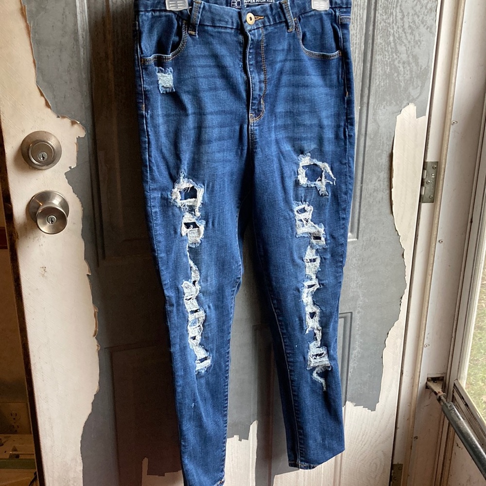 Women ripped blue jeans